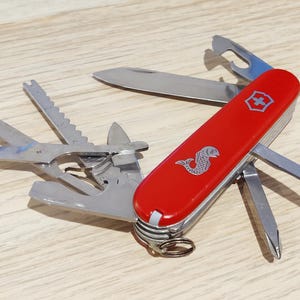 VICTORINOX swiss armyジャンク品 Amazon.com: Victorinox Swiss Army Trekker Large Pocket Knife