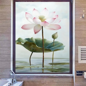 May include: A pink and white lotus flower with green leaves and a light blue background. The lotus flower is in bloom and has a delicate, feminine appearance.