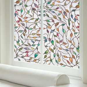 May include: A stained glass window film with a leafy pattern in shades of brown, green, blue, red, and yellow.