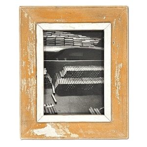 May include: A framed black and white photograph of cigars. The image shows stacks of cigars inside a humidor. The frame is made of wood with a distressed, weathered finish in shades of tan and white.