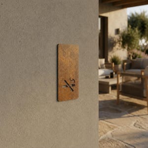 May include: A rectangular, rust-coloured metal sign with rounded corners mounted on a textured wall. The sign features a cutout graphic of a cigarette with a diagonal line through it, indicating a no smoking policy in a clear, visual format.