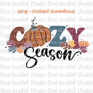 May include: A digital illustration of a pumpkin with a leopard print design, leaves, and the text "COZY Season". The text is in a distressed, vintage style.