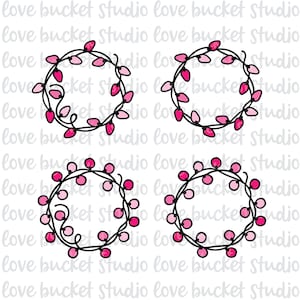 May include: Four pink and white string light wreaths with black outlines. The wreaths are drawn in a simple, hand-drawn style.
