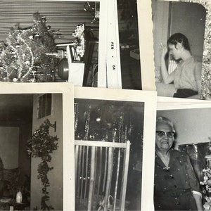 May include: A collection of black and white photographs showing various people and scenes from a holiday gathering. The photos are arranged in a collage format and include images of a decorated Christmas tree, a group of people gathered around a table, and a single person standing in front of a decorated Christmas tree.
