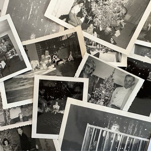 May include: A collection of black and white photographs of families celebrating Christmas. The photos show people of different ages, including children, adults, and seniors, posing in front of decorated Christmas trees and holding gifts.