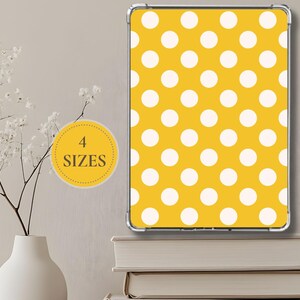 May include: A yellow and white polka dot pattern is displayed on a rectangular object. The image also includes a yellow circle with the text "4 SIZES". A white vase with flowers is in the background.