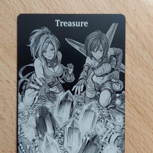 May include: A rectangular black card featuring the word Treasure printed in white at the top. The illustration depicts two anime-style characters kneeling amidst a large pile of coins, jewelry, and several large, faceted crystals.