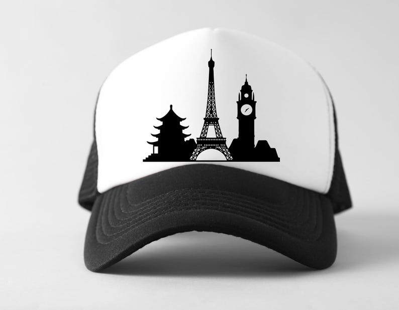 May include: A black and white trucker hat featuring a silhouette design of famous landmarks. The design includes a pagoda, the Eiffel Tower, and Big Ben. The hat has a white front panel and a black mesh back and brim.