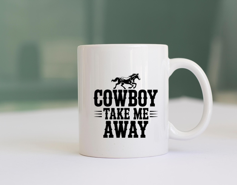 May include: White ceramic mug with a black graphic of a running horse above the words "COWBOY TAKE ME AWAY". The mug has a curved handle and is suitable for hot or cold beverages.