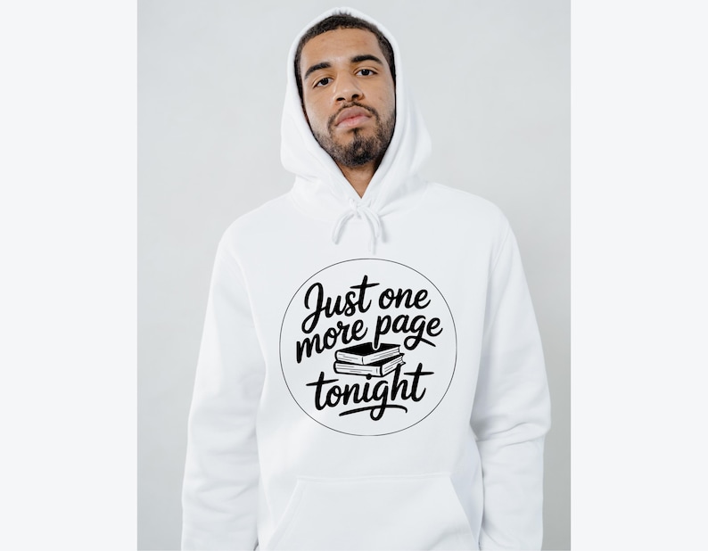 May include: White hooded sweatshirt with the text "Just one more page tonight" in a black circular design. The design includes two stacked books. The sweatshirt has a drawstring hood and a front pocket.