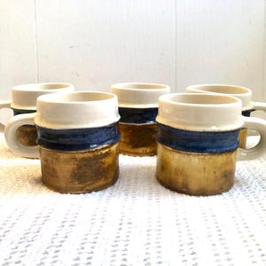 Vintage ceramic mugs from Laurentian Pottery - amber, blue and white tricolors