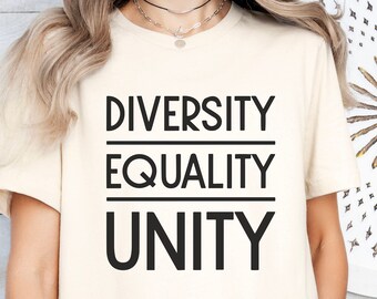 May include: A beige t-shirt with the words "Diversity Equality Unity" printed in black.