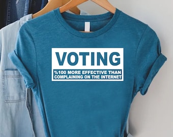 May include: A teal blue t-shirt with a white rectangle that says "Voting" and "100% more effective than complaining on the internet".