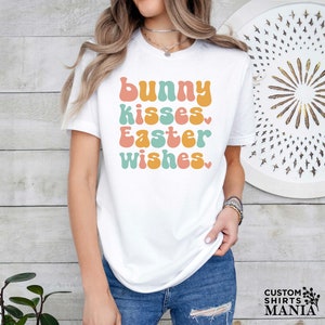 a woman wearing a t - shirt that says bunny kisses easter wishes