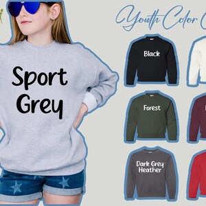 May include: A youth color chart for sweatshirts showing different colors, including Sport Grey, Black, White, Forest, Maroon, Dark Grey Heather, and Red.