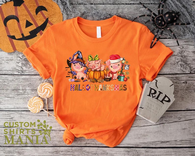 an orange shirt with three little pigs on it