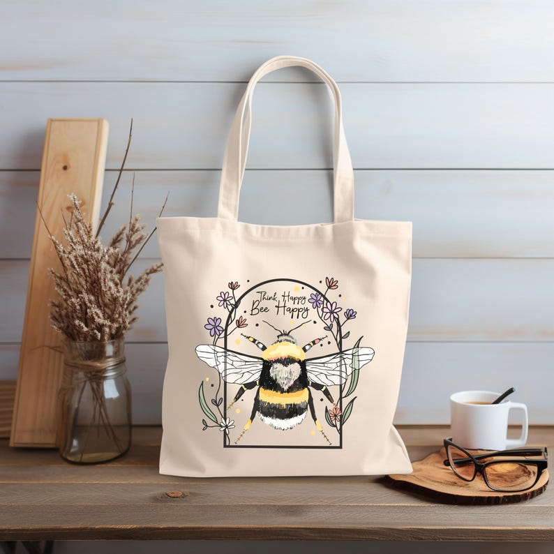 a white bag with a picture of a bee on it