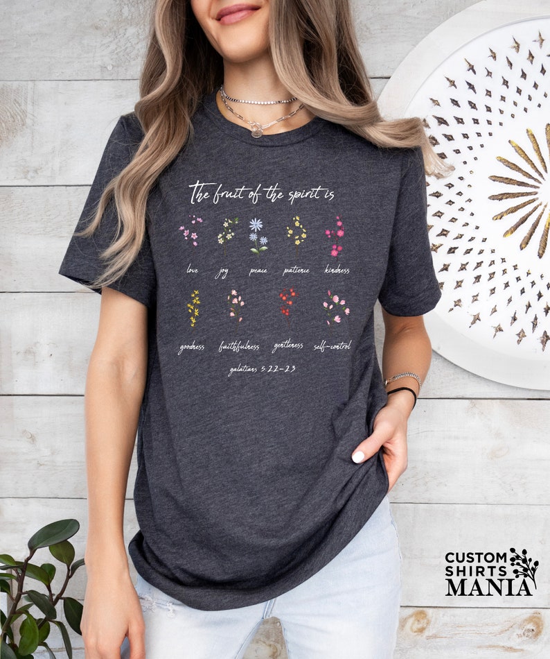 a woman wearing a black t - shirt with the words, the great of the