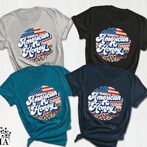 three american eagle t - shirts on a white background