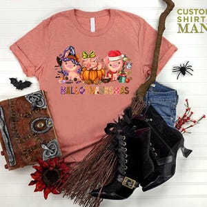a t - shirt with a picture of three little pigs on it