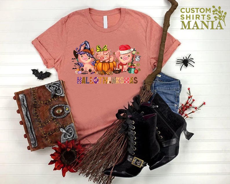 a t - shirt with a picture of three little pigs on it