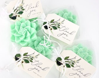 May include: Four small green succulent-shaped soaps are packaged in individual white organza bags with a white ribbon. Each bag has a small white tag with green foliage and the text "Thank you very much".