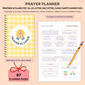 May include: A yellow and white gingham-patterned Prayer Planner with a spiral binding. The cover features a circular logo with praying hands. The planner includes daily, weekly, and monthly planning pages. A pencil rests on the right side.
