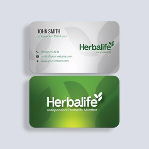 a business card with a green leaf design