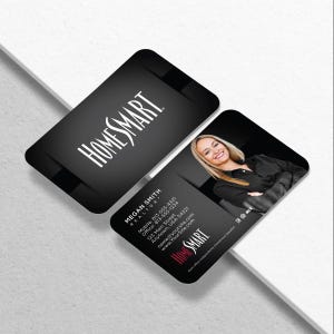 May include: Black business cards with rounded corners. One card features the Homesmart logo in white. The other card has a photo of a smiling woman, contact information, and the Homesmart logo in red.
