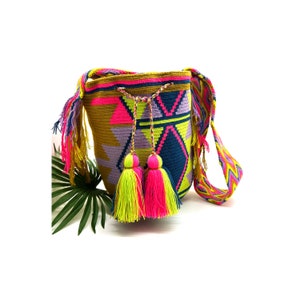 Beautiful large artisan cross-body Wayuu bag/tote made with braided cotton. Decorated with stunning tassels. Delicately handmade in Colombia