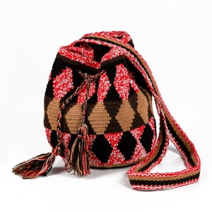 Beautiful small artisan cross-body Wayuu bag/tote made with braided cotton. Decorated with stunning tassels.Delicately handmade in Colombia.