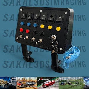 May include: Black control panel with multiple buttons, switches, and a key. The panel has blue, red, and yellow buttons, along with toggle switches. A blue USB cable is attached. The text "SAKAL3DSIMRACING" is visible.