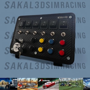May include: A black sim racing control panel with multiple switches, buttons, and a key. The panel has a carbon fiber texture and includes the text "SAKAL3DSIMRACING". It features toggle switches, push buttons, and a key switch.