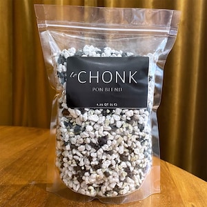 May include: A clear plastic resealable pouch filled with a granular substrate mix of white, gray, and black stones. A black rectangular label on the front reads le CHONK PON BLEND 1.25 QT (5 C) in white text, indicating the contents and volume.