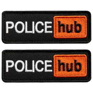 May include: Two black rectangular patches with white embroidered text that reads "POLICE" and an orange square with the word "hub" in black. The patches are side by side.