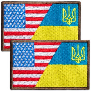 May include: Two embroidered patches featuring a split design: one side displays the American flag with blue, white, and red, and the other side shows the Ukrainian flag with blue and yellow. Each patch has a brown border.