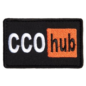 May include: Black rectangular patch with white embroidered text "CCO" on the left and orange embroidered text "hub" inside an orange square on the right. The patch has a black border.