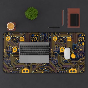 May include: A black and yellow circuit board design desk mat with a laptop and a white mouse on top.