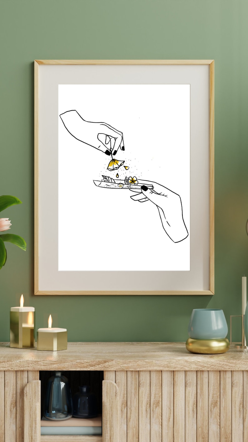 May include: A black and white line drawing of two hands rolling a joint with yellow flowers. The flowers are falling from the hand on the top of the image.