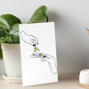 May include: A black and white line drawing of two hands rolling a joint with yellow flowers. The flowers are falling from one hand into the joint.