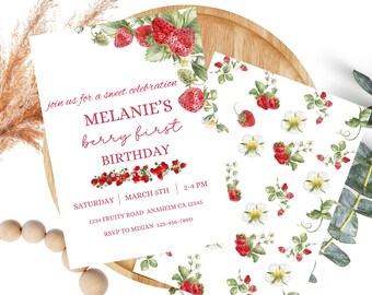 May include: A printable invitation for a first birthday party with a strawberry theme. The invitation features a red and white strawberry design with the text "join us for a sweet celebration Melanie's berry first birthday" and party details.