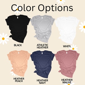 May include: Color options for t-shirts in black, athletic heather, white, heather peach, heather navy, and heather mauve.