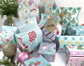 May include: A collection of Christmas-themed gift boxes in various shapes and sizes. The boxes feature festive patterns like gingerbread houses, candy canes, and Santa Claus. Some are tied with twine and adorned with tags that read "Merry Christmas Happy New Year".