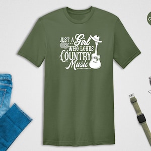 May include: A green t-shirt with the text "Just a Girl Who Loves Country Music" and a guitar graphic.