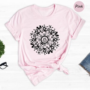 May include: A pink t-shirt with a black design of a circle with science-related icons and the text "Lab Tech" in the center.