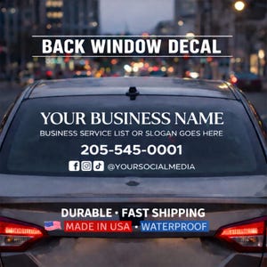 May include: A back window decal on a car with the text "BACK WINDOW DECAL". The decal includes space for a business name, service list, phone number, and social media handles. Additional text reads "DURABLE • FAST SHIPPING" and "MADE IN USA • WATERPROOF".