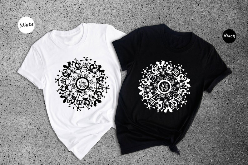 May include: Two t-shirts, one white and one black, with a circular design featuring the words "Lab Tech" surrounded by science-related icons.