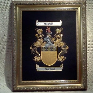 Embroidered Single Coat of Arms in frame.