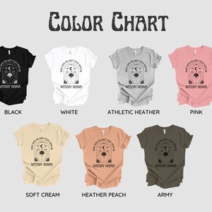 May include: Color chart showing different t-shirt colors available for purchase. The t-shirt design features a black and white illustration of a crescent moon, stars, mushrooms, and the text "Frew with me, we don't play with me, we're witchy mama".
