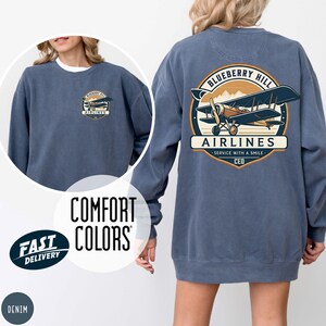 Denim Comfort Colors sweatshirt with personalized logo print – front and back views of branded merch crewneck in muted denim-blue.